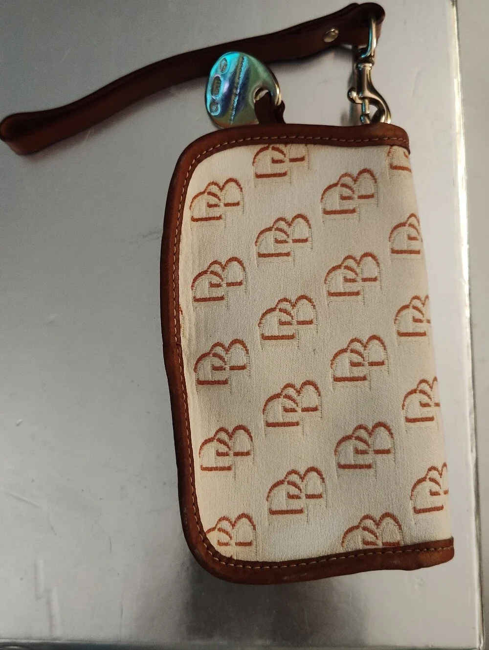 Dooney Bourke Vintage Wristlet Snap Repeating Logo, Cream/Tan